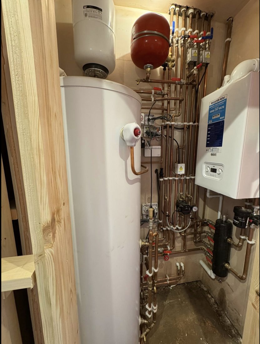 A plant room fitted by Central Gas: Baxi boiler, unvented hot water cylinder and neatly run copper pipework